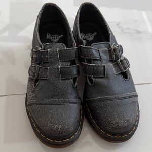 Dr. Martens woman’s charcoal Distressed Double-Strap Leather Shoes